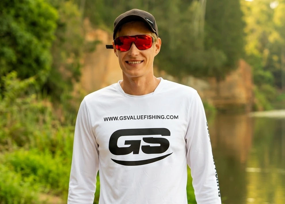 Girts from GS Value Fishing wearing branded shirt at the riverside